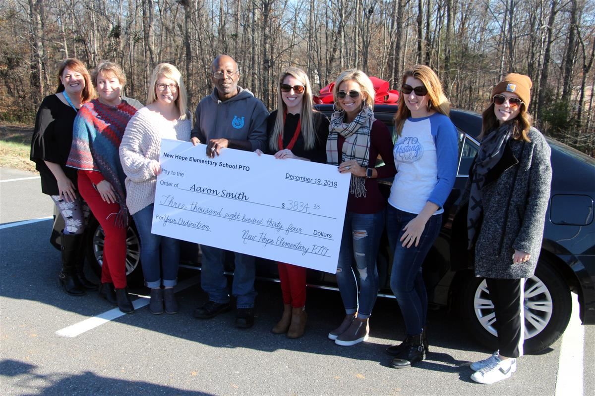 New Hope Elementary School Aaron Smith was given a new vehicle and presented with a check by the school PTO. 