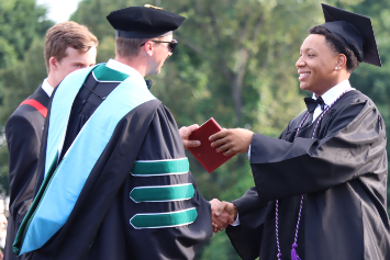 A photo of a student at South Point High School graduation.