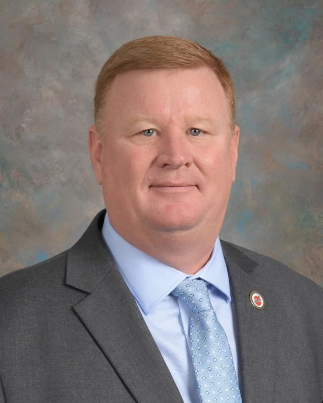 A photo of Board of Education member Josh Crisp.