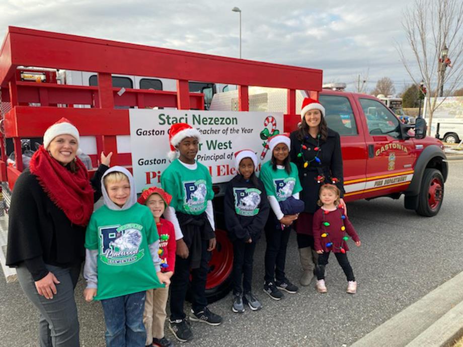 Tyler West and Stacie Nezezon with a group of Pinewood Elementary students in the Gastonia Parade