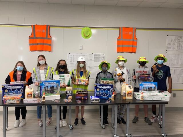 Blake Construction provided $1,200 in supplies, reading material, and blueprints to students in the construction class at Belmont Middle School. Brooke Loftis is the teacher.